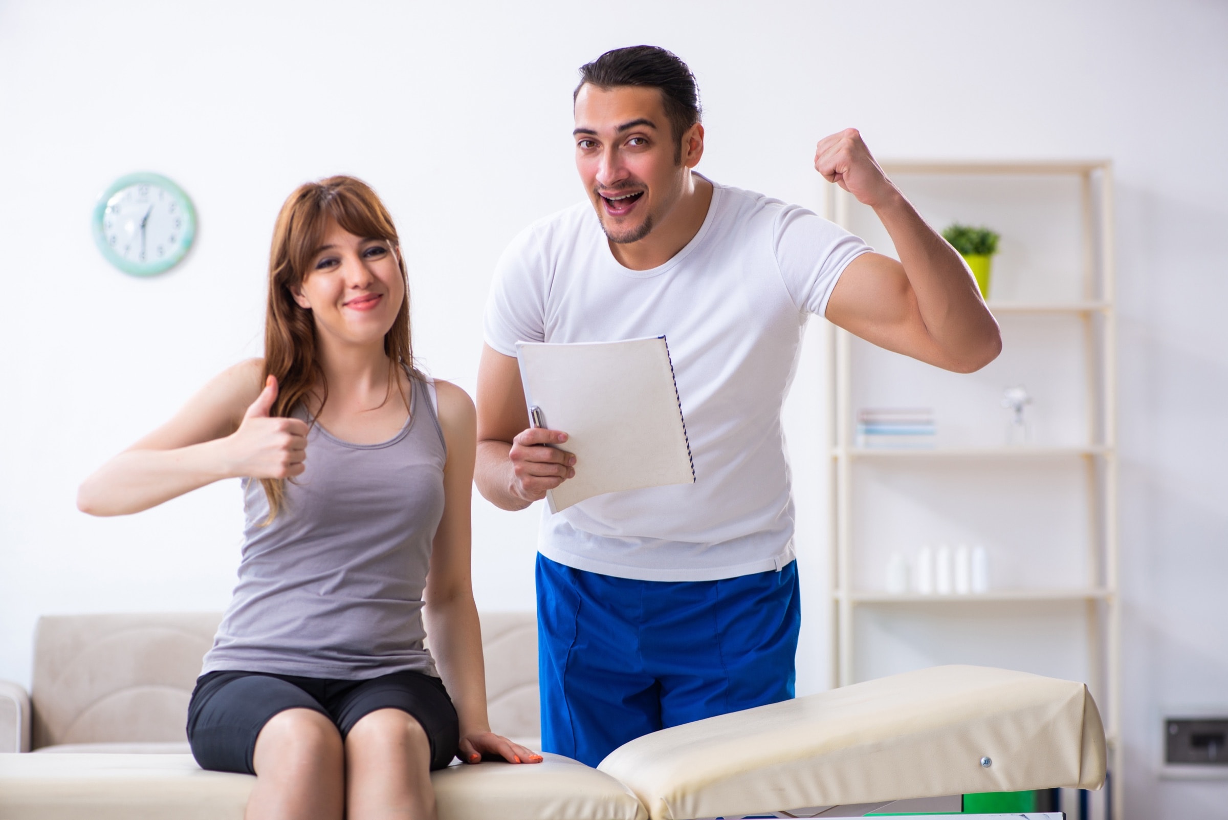 Male therapist and a smiling woman patient after treatment