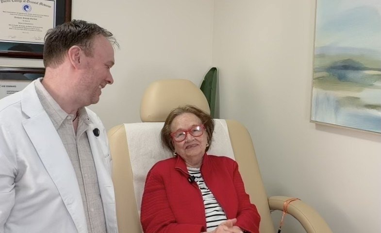 Dr. Anthony Gordon with a patient at his North New Hyde Park office